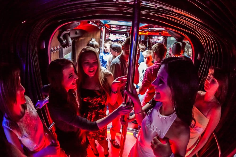 Guests dancing under neon lights